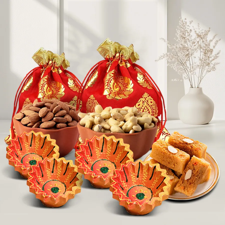 Diwali Sweets and Diyas Radiance Box featuring premium cashews, almonds, milk cake, and designer clay diyas