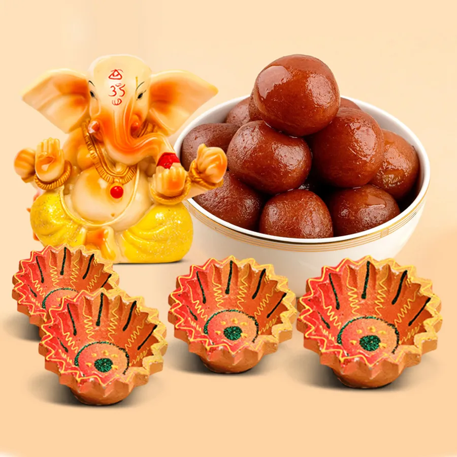 Elegant Diwali Sweet and Gift Hamper including Gulab Jamun, Vignesh Ganesh figurines, and designer clay diyas