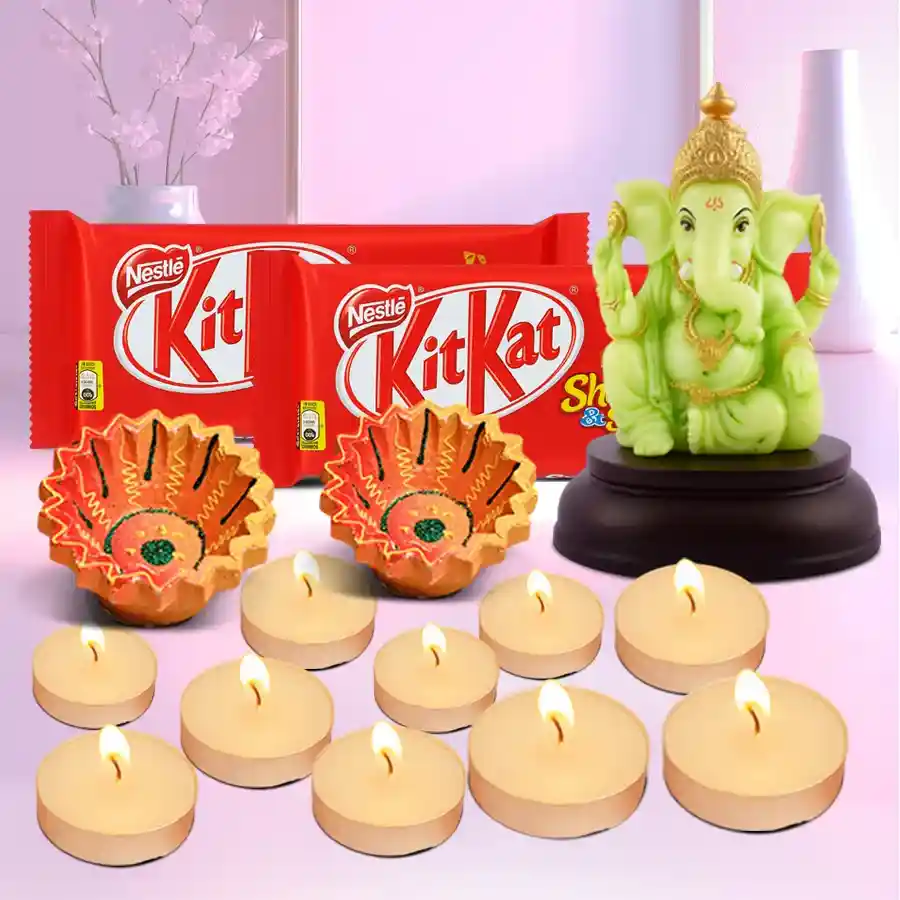 Traditional Diwali Gifts Delight Hamper featuring a Glowing Ganesh Idol, KitKat Share Snaps, T-Light candles, and clay diyas.