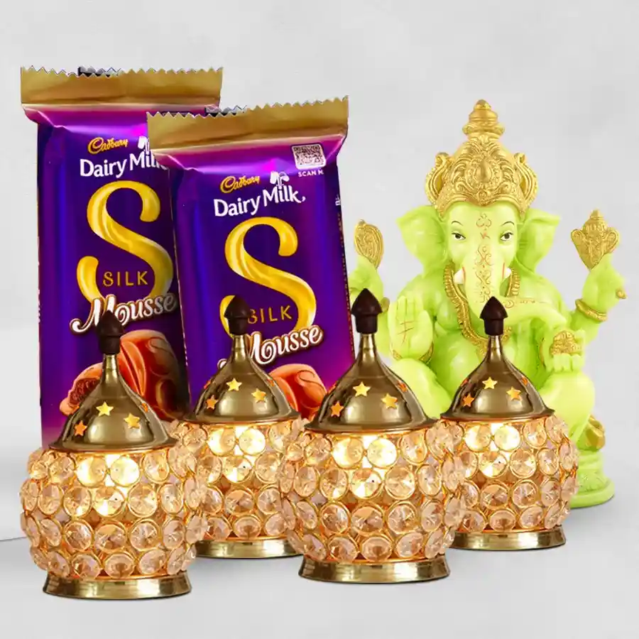 Joyful Diwali Gift Hamper featuring a Designer Glowing Ganesh Idol, two Cadbury Dairy Milk Silk Mousse Chocolates, and four Designer Crystal LED Lights.