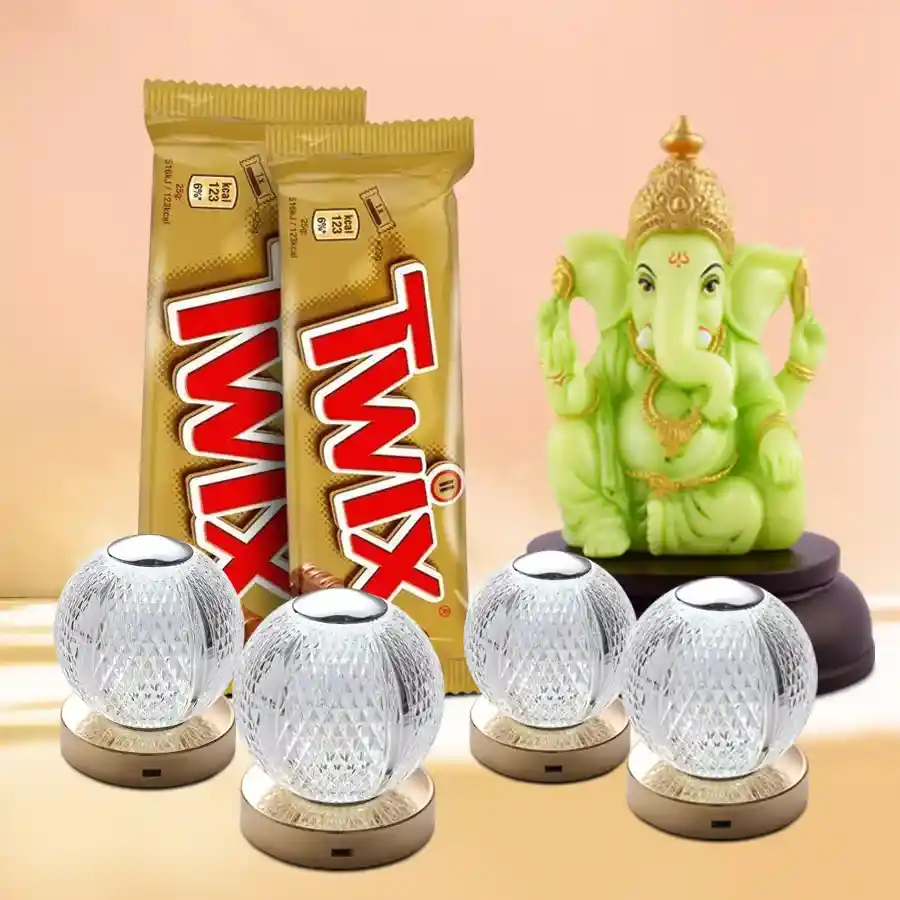Exquisite Diwali Gift Set featuring a Designer Glowing Ganesh Idol, two Twix chocolates, and four sparkling Designer Crystal LED Lights