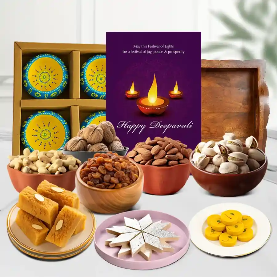 Diwali Joy Box featuring traditional sweets, premium nuts, designer clay diyas, and a Happy Diwali card presented in a stylish tray.