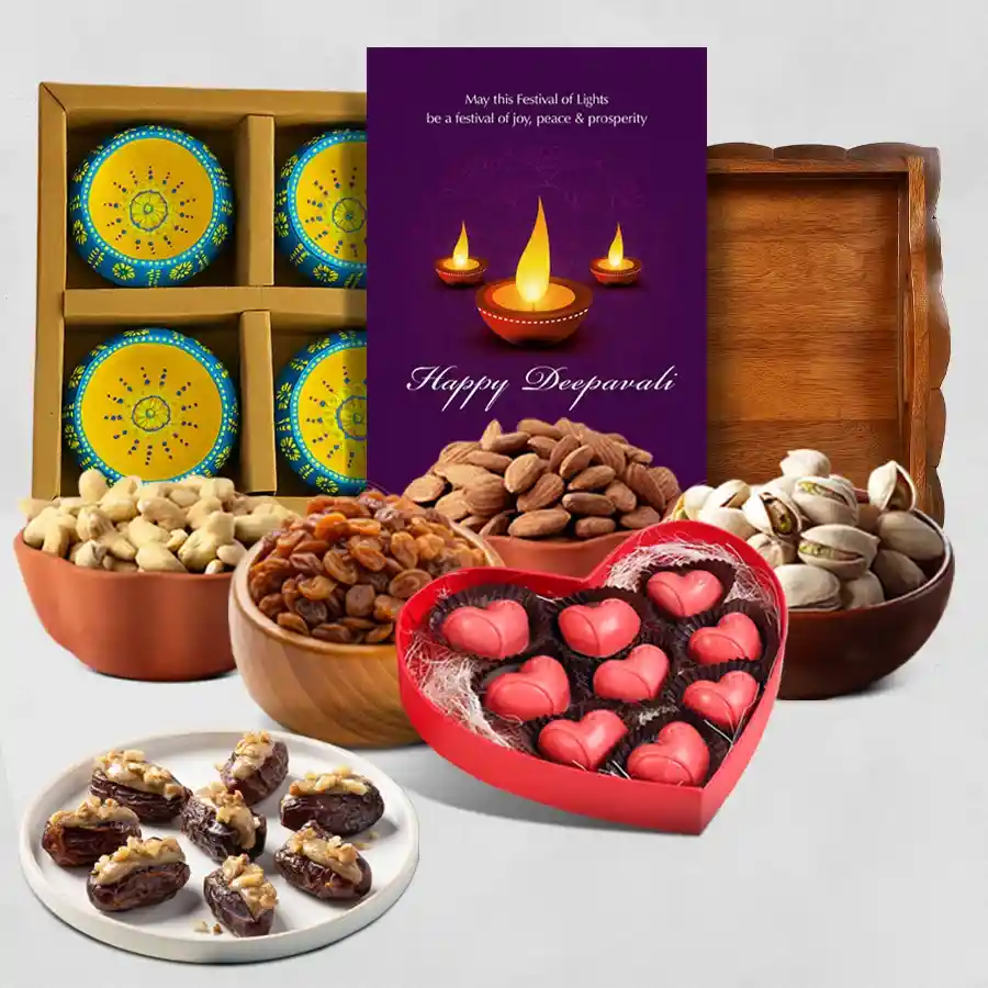 Sweet Surprises and Festive Delights Hamper featuring walnut-stuffed dates, assorted nuts, heart-shaped chocolate box, clay diyas, fancy tray, and a personalized Happy Diwali card.
