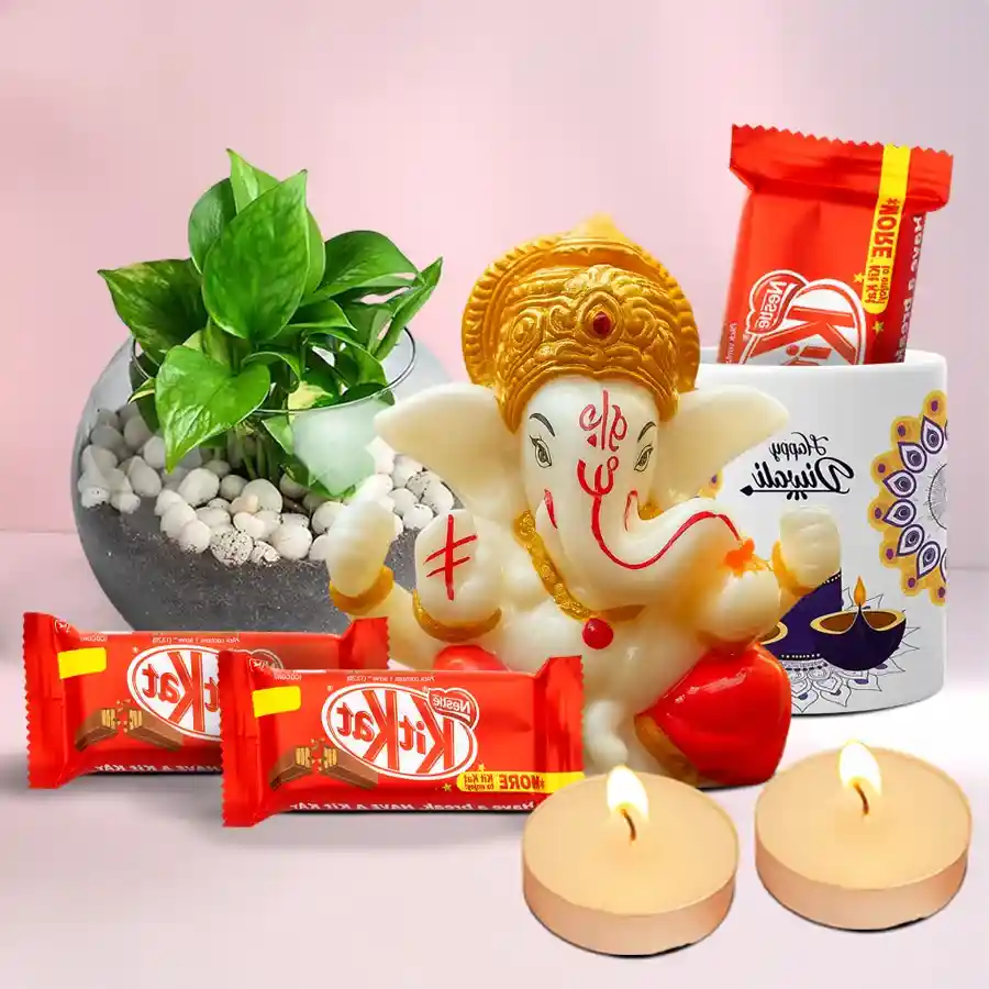 Joyful Diwali Gift Hamper featuring Polyresin Mukut Ganesh Idol, indoor money plant, Ceramic Mug, Nestle KitKat chocolates, and scented T-light candles arranged in a festive setting.