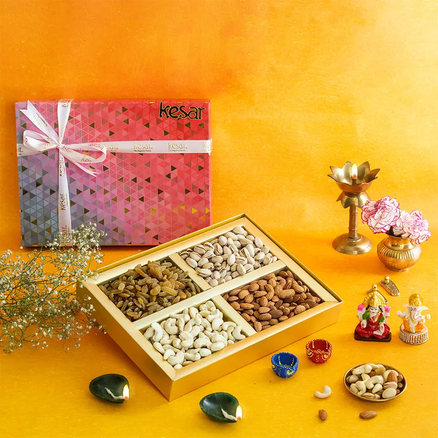 Luxurious and colourful Diwali dryfruit gift box featuring premium cashews, almonds, pistachios, raisins, a Ganesh Laxmi idol, diyas, and a Diwali greetings card, all beautifully wrapped in a festive box.