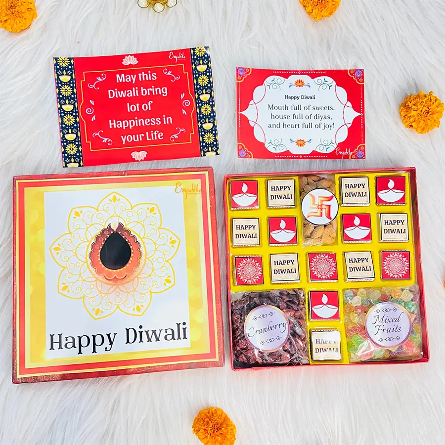 Delightful Deluxe Diwali Celebration Gift Box featuring an assortment of chocolates, roasted almonds, mixed fruits, and cranberries, adorned with festive digital prints and a Diwali greeting card.