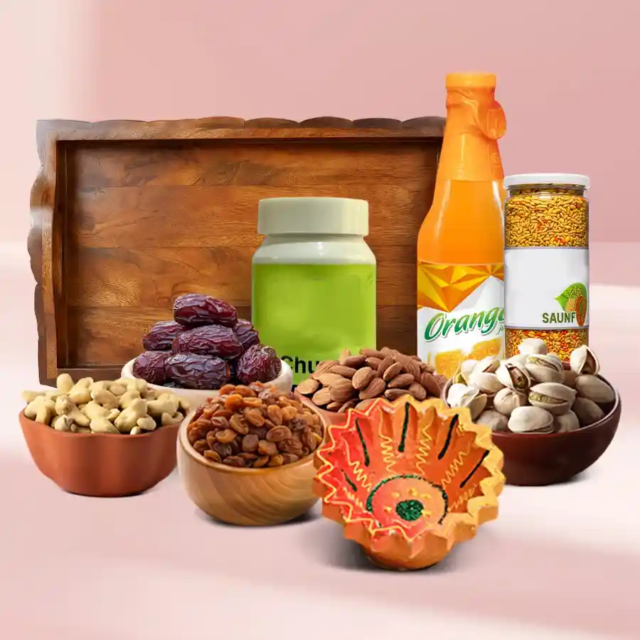 Elegant Diwali Gifting Set featuring a diya, premium nuts, refreshing juice bottle, traditional churna and saunf, arranged in a stylish reusable tray.