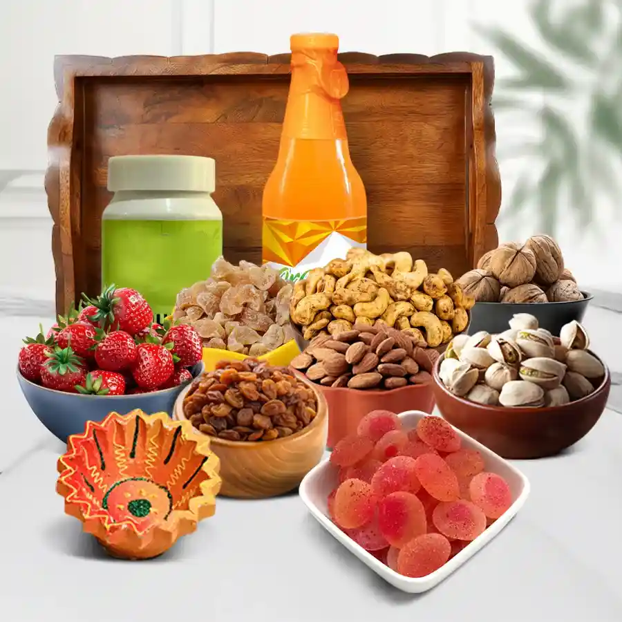 Exquisite Gourmet Diwali Gift Tray featuring flavored cashews, pistachios, almonds, candies, a diya, refreshing juice, and a churna bottle, all presented on a stylish designer tray.