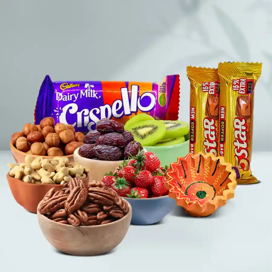 Sweet N Savory Diwali Hamper featuring a Diya, nuts, dates, kiwis, strawberries, and Cadbury chocolates