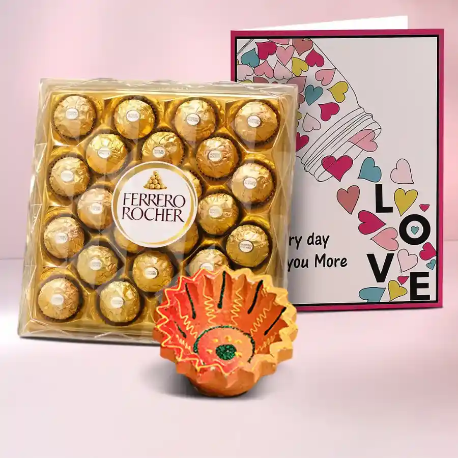 Diwali Hamper with nuts, fruits, a diya, Ferrero Rocher chocolates, and a personalized message card