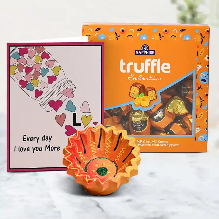 Handcrafted Diya and luxurious Sapphire Truffle Chocolates in a festive hamper for Diwali celebration.