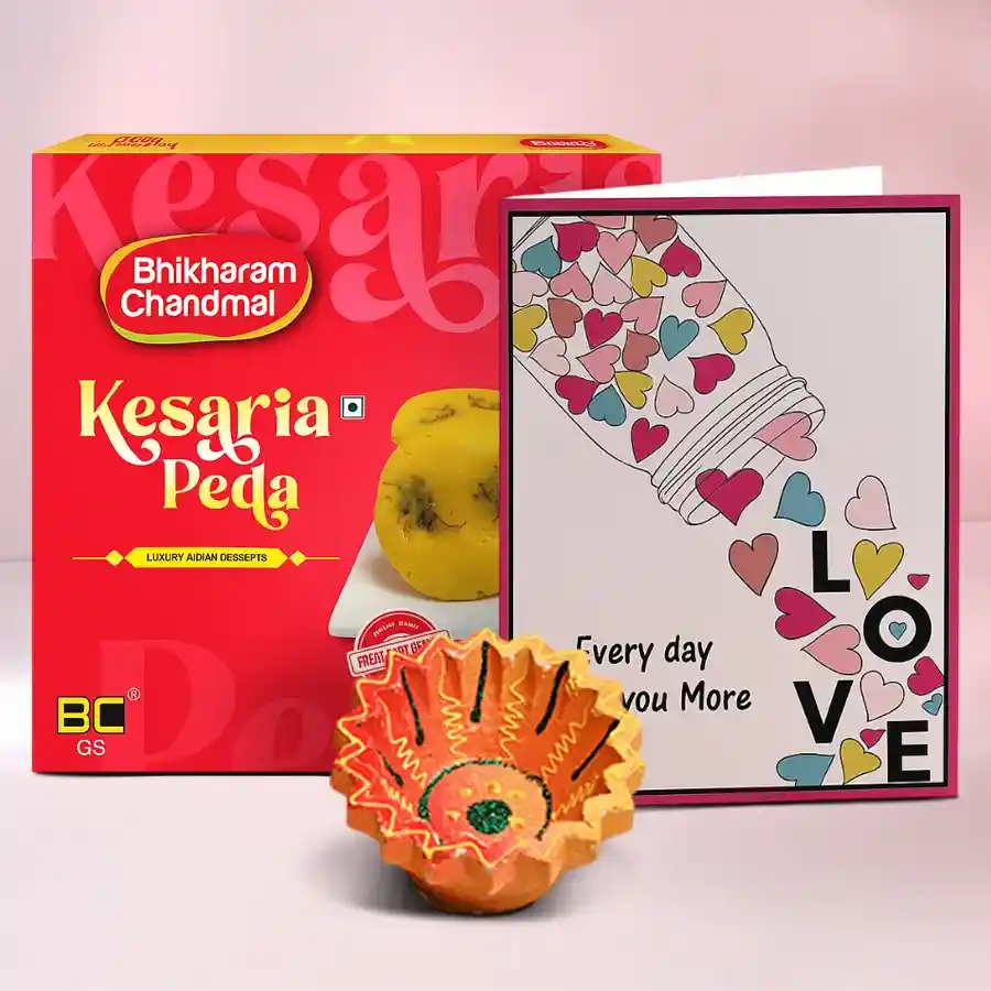 Diwali celebration combo featuring a diya, Kesaria Peda sweets, and a message card
