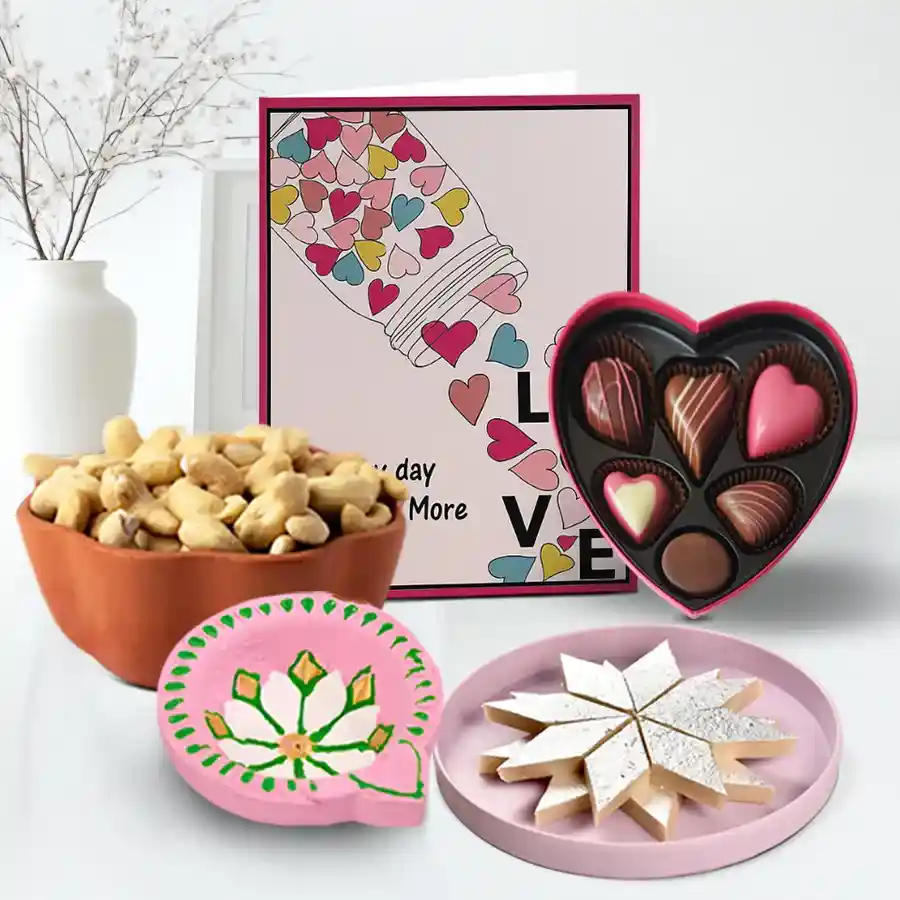 Diwali hamper featuring a colorful diya, a box of Kaju Katli sweets, premium cashews, and handmade heart-shaped chocolates, along with a customizable message card.