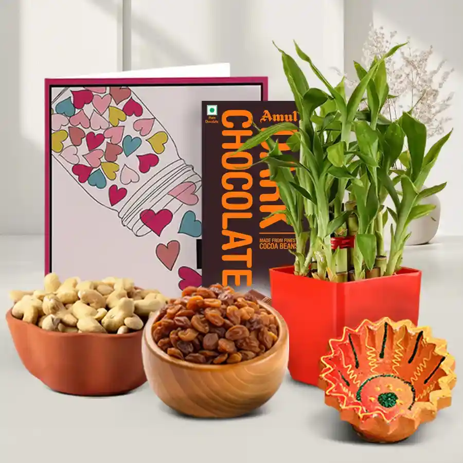 Lucky Bamboo and Sweets Hamper featuring a diya, cashews, raisins, Amul Dark Chocolate Bar, and a three-tier lucky bamboo plant, all beautifully arranged for Diwali celebration.