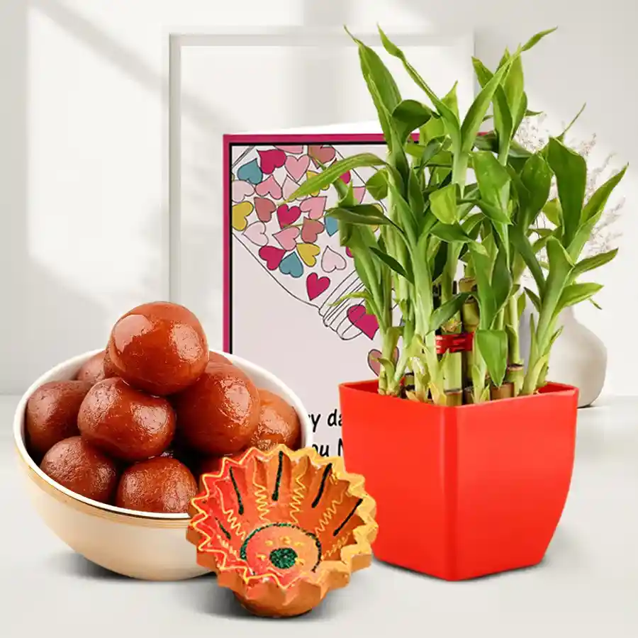 Diwali Hamper featuring a Diya, three-tier Lucky Bamboo Plant, and 1kg of Gulab Jamun with a message card