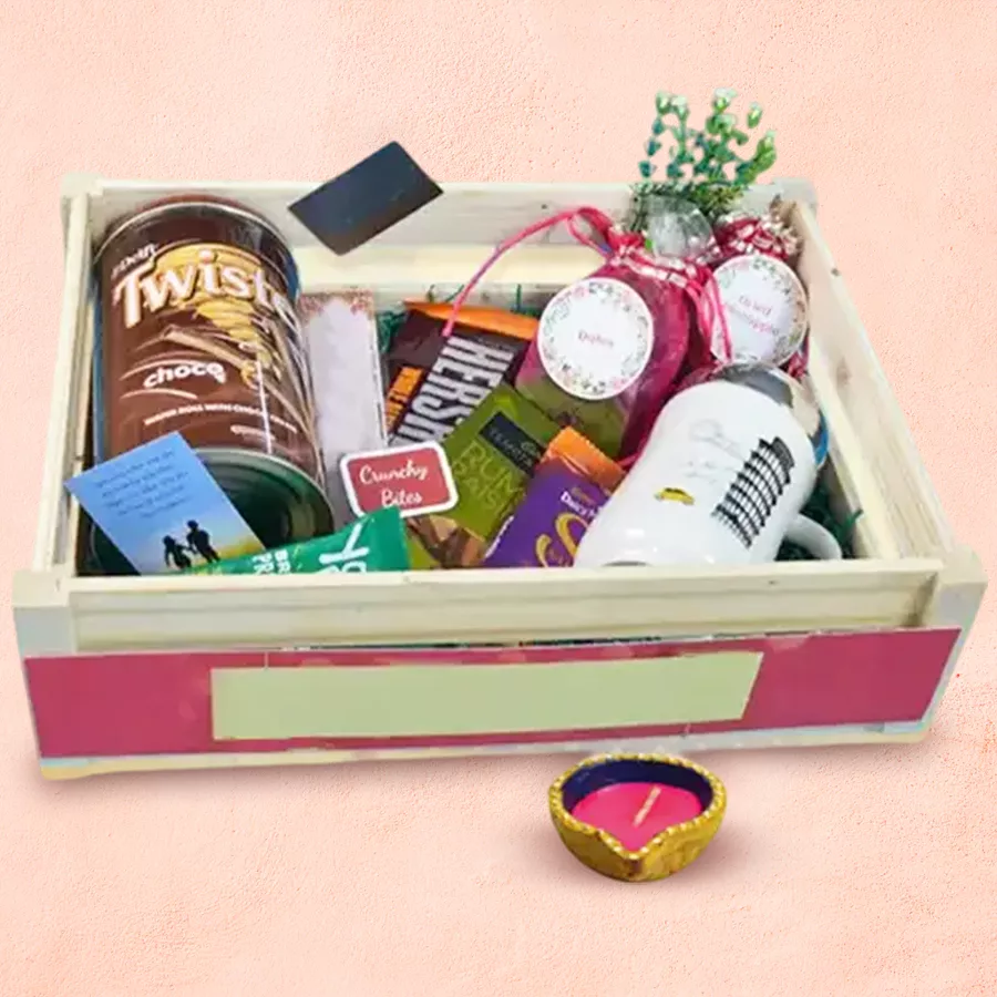 Diwali Bliss Hamper featuring a Diya, assorted chocolates, candies, dried fruits, and festive decorations
