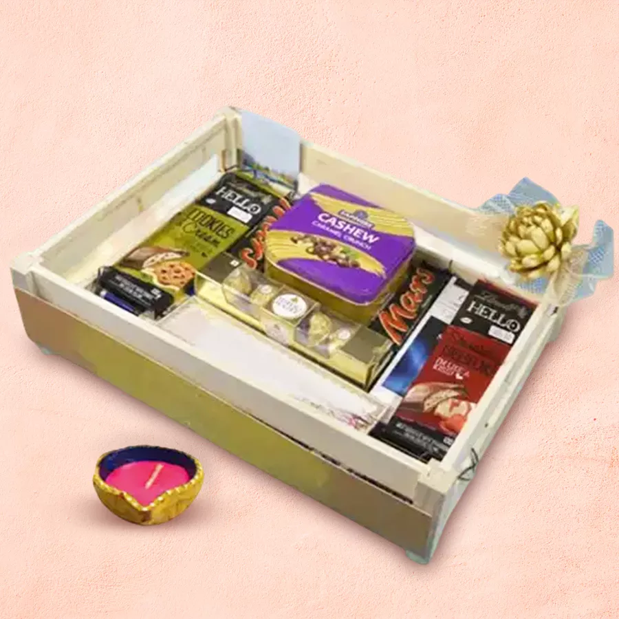 Diwali Treats Hamper featuring MARS bars, Ferrero Rocher, Sapphire Cashew Caramel Crunch, Lindt chocolates, and a decorative Diya