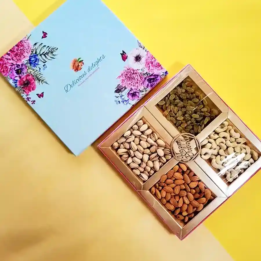 A stylish designer gift box containing 125g each of cashews, almonds, pistachios, and raisins, ideal for Diwali celebrations.
