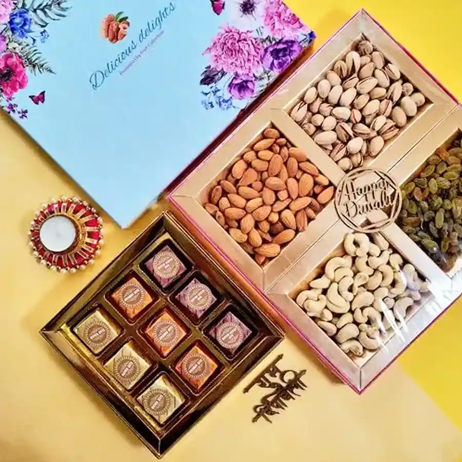 A beautifully arranged gift box filled with premium nuts, fudge bites, and a designer T-light candle set, perfect for Diwali celebrations.