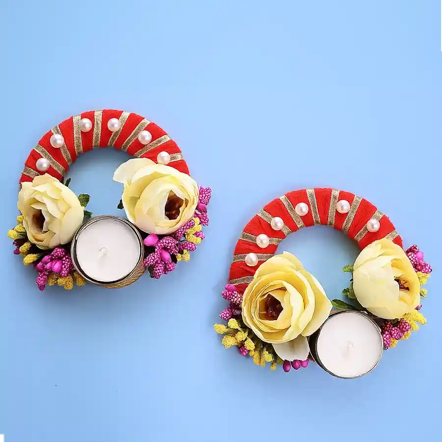 Two Exquisite Designer T-Light Candles Set on a stylish surface with a warm glow illuminating the surroundings.