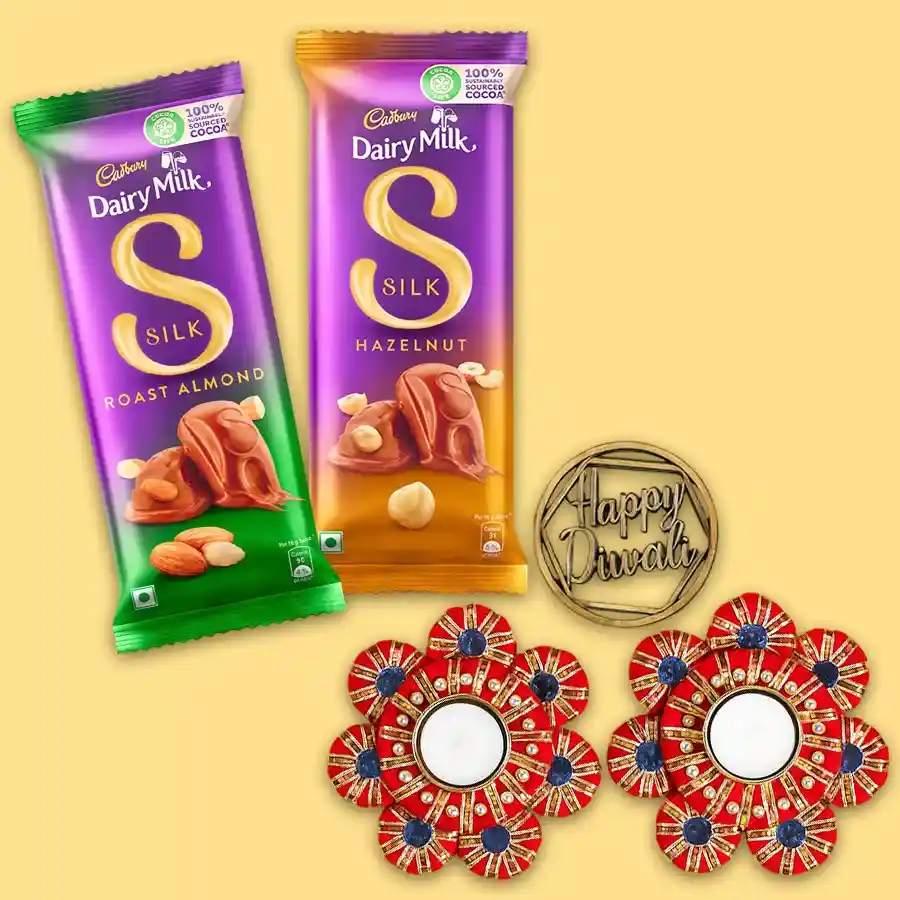Divine Chocolate and Candle Gift Set featuring Cadbury Dairy Milk Silk Roast Almond and Hazelnut chocolates with stylish designer T-light candles, perfect for Diwali celebrations.