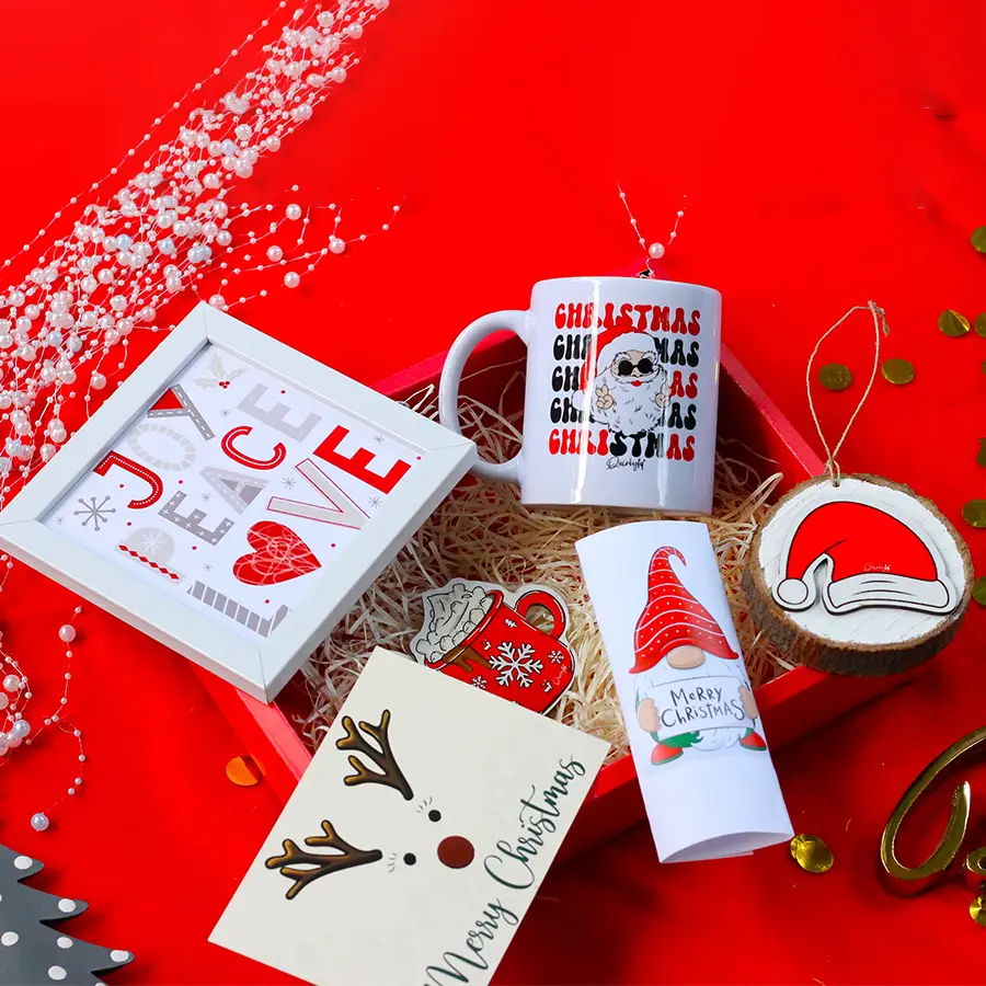 Christmas gift set including eggless chocolates, a postcard, a quirky hanging log, a wall frame, a fridge magnet, and a cozy mug.