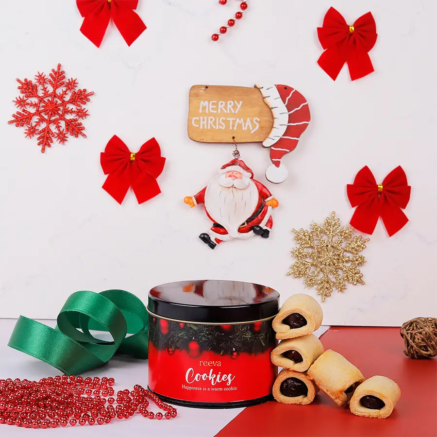 Delicious Date Walnut Rolls arranged in a gift pack on a wooden surface.