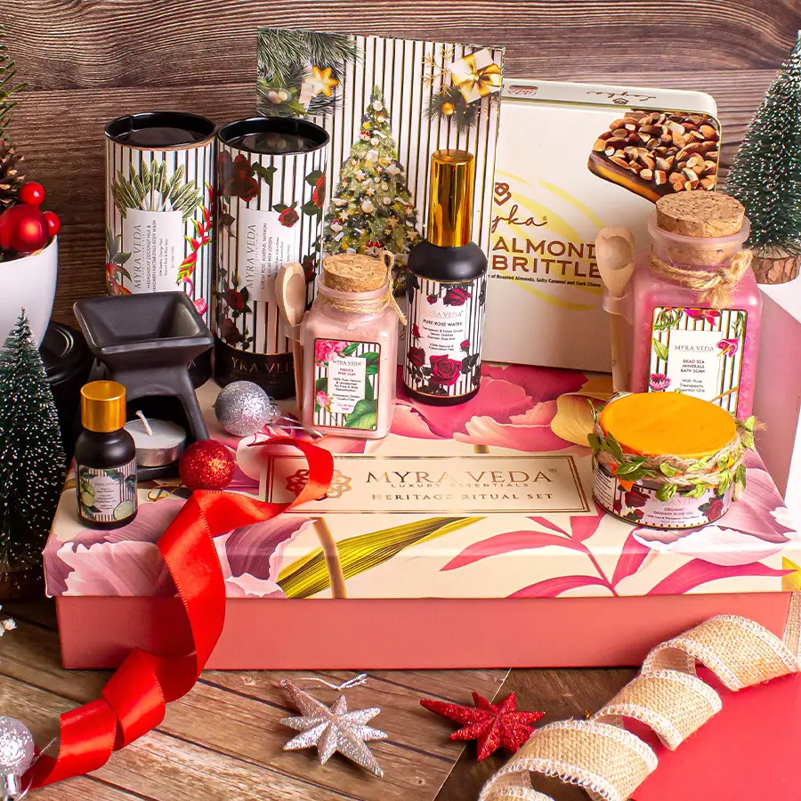 Relaxation N Retreat Gift Box featuring Almond Brittle Chocolate, calming Bath Soak, Turkish Rose Lotion, Coconut Milk Body Wash, aromatic candles, and Bergamot Essential Oil diffuser.