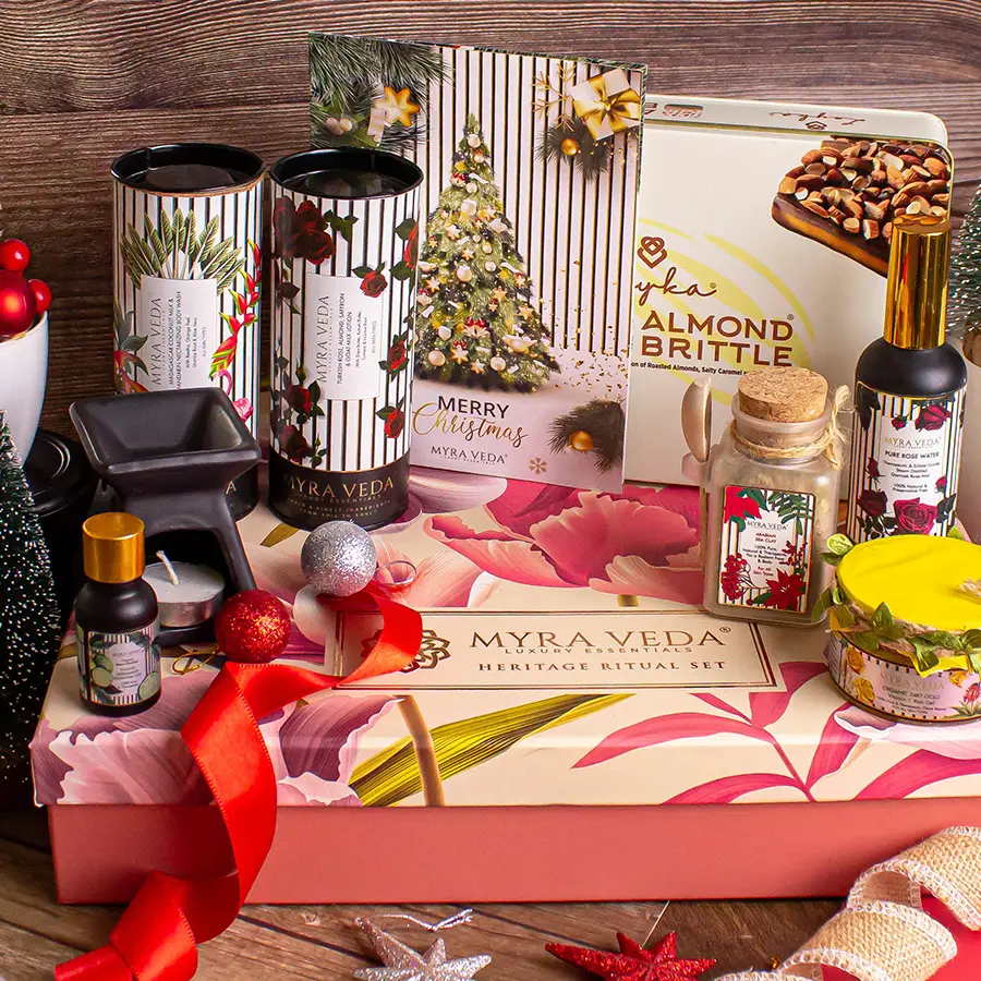 Exotic Spa N Treat Gift Hamper featuring almond brittle chocolate, pure rose water, lotions, body washes, organic soy candles, 24K gold gel, bergamot essential oil, and a stylish diffuser.