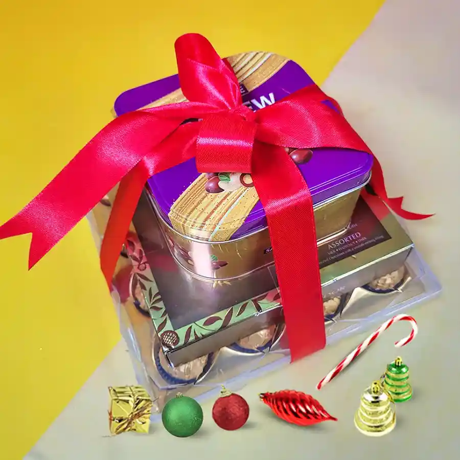 Elegant gift tower filled with Ferrero Rocher chocolates, Lindt Lindor assorted chocolates, and Sapphire Cashew Caramel Crunch, tied with a charming ribbon.