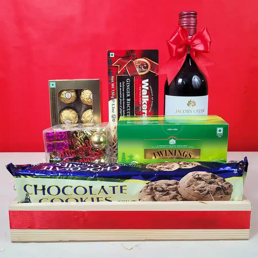 Christmas Cheers Gift Hamper featuring Jacobs Creek Non-Alcoholic Shiraz, Ferrero Rocher chocolates, Merba chocolate cookies, Walkers ginger biscuits, Twinings green tea, and a Christmas Decoration Box in a beautifully wrapped chest or basket.