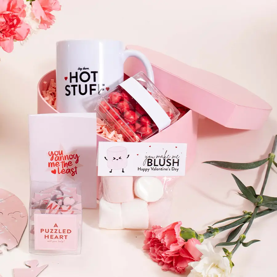 Sweet Sentiments Gift Set featuring a white ceramic mug, marshmallows, a heart puzzle, cherry dragees, and a heart-shaped box.