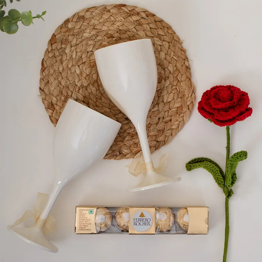 Sip, Love N Celebrate Gift Set featuring white wine glasses, a handcrafted crochet red rose, Ferraro chocolates, and a decorative Love wrapping paper box