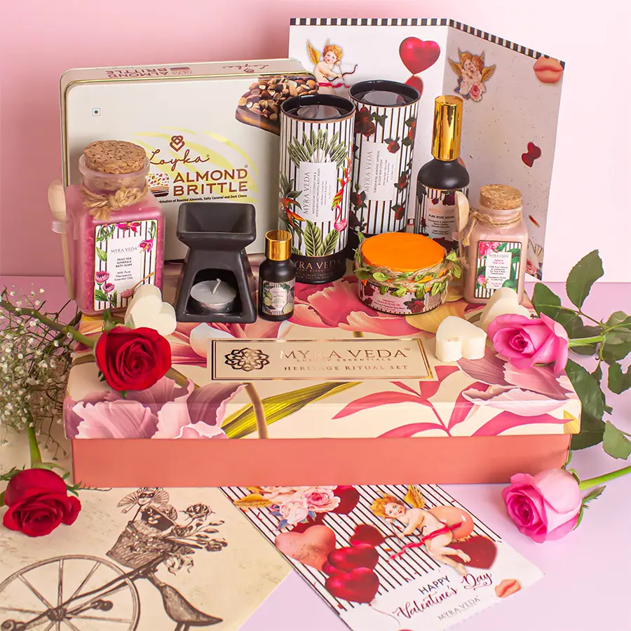 Valentine's Day Te Quiero Hamper featuring essential oil, diffuser, tea light candle, greeting card, almond brittle chocolates, lotions, body wash, rose water, gold gel, clay, and bath soak arranged in an elegant gift box.