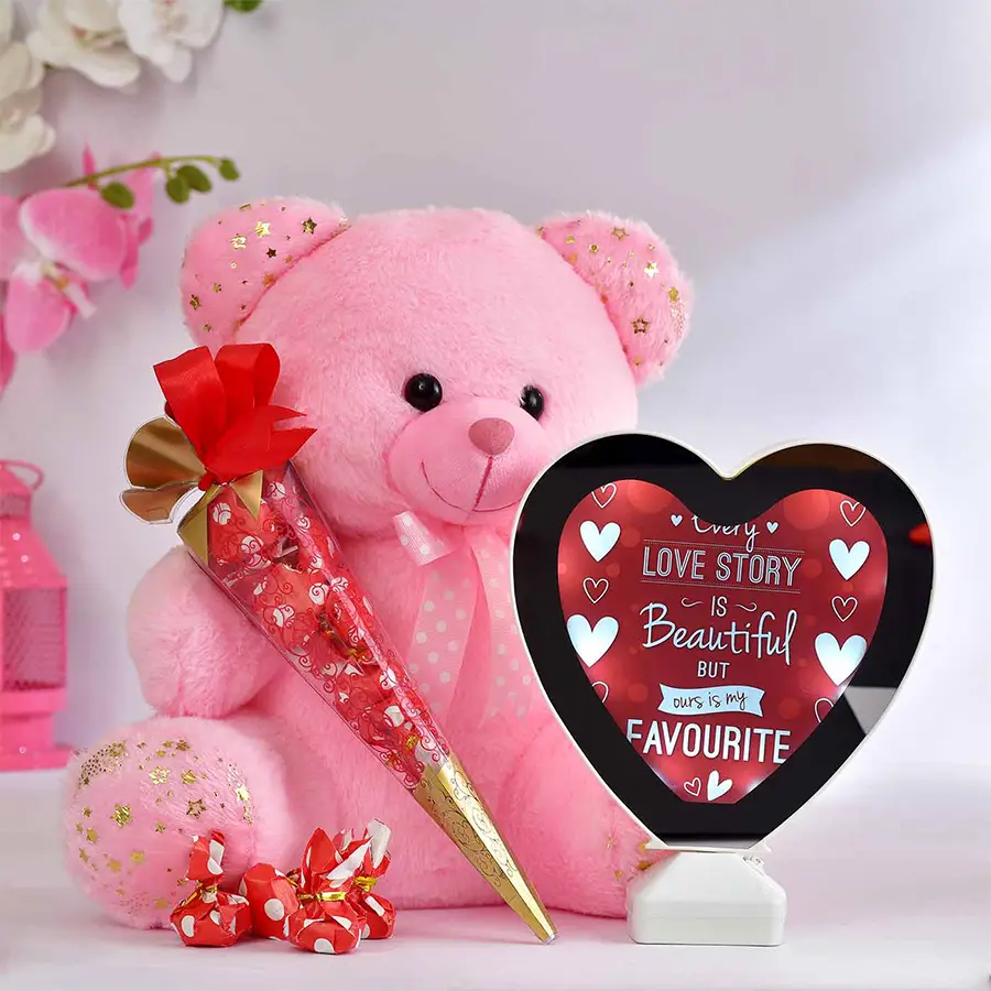 Enchanting Teddy Combo with pink teddy bear, heart-shaped chocolate cones, and heart-shaped mirror photo frame