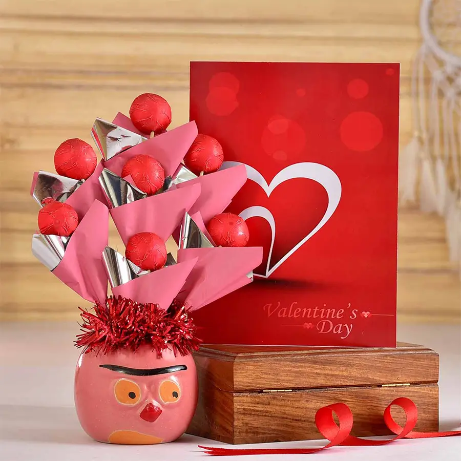 Luxe handmade chocolates arranged in a pink ceramic pot with a Valentine's Day card