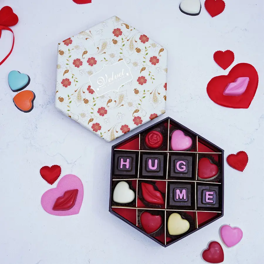 Assorted handcrafted chocolates in an elegant gift box with a variety of flavors and textures