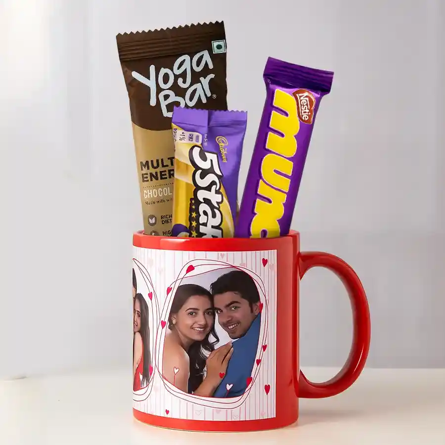 Personalized coffee mug with a photo, Cadbury 5 Star 3D, Yoga Bar multigrain energy bar, and Nestle Munch in a gift set arrangement.