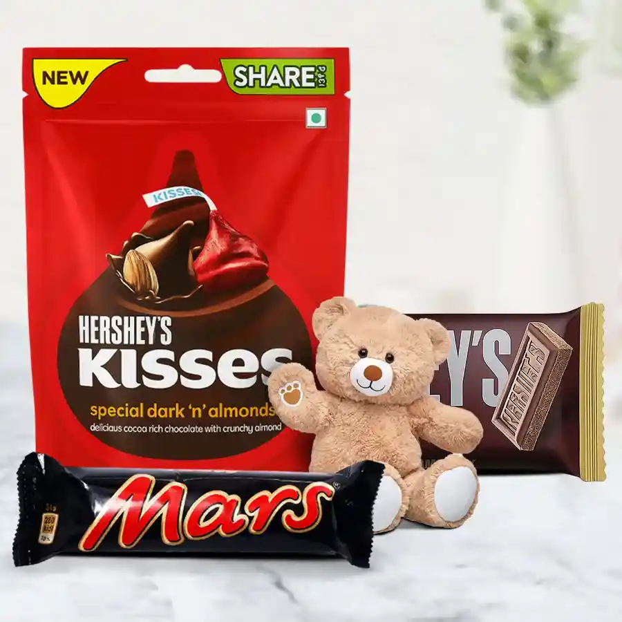 Exquisite Chocolates and Teddy Bear Valentine Combo featuring Hershey Kisses, Mars Bar, Hershey Milk Bar, and a 3-inch Teddy Bear.