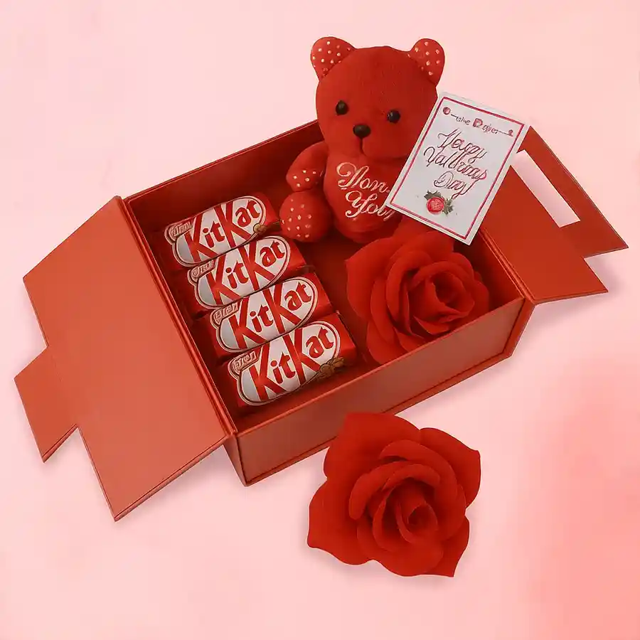 Sweethearts Pendant Necklace, five Kit-Kat bars, and a small red teddy bear in a Gift Set.