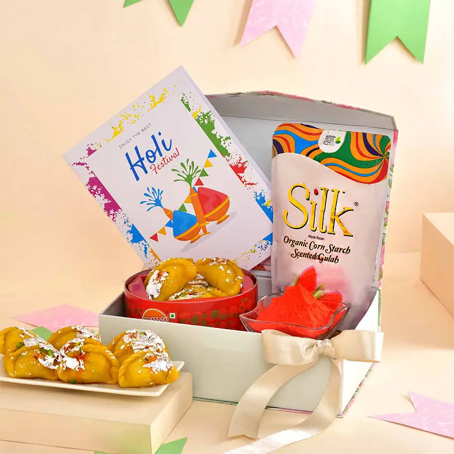 Sensory Holi Celebration Gift Hamper featuring colorful gulal, sweet gujiya, personalized card, and a festive celebration box.