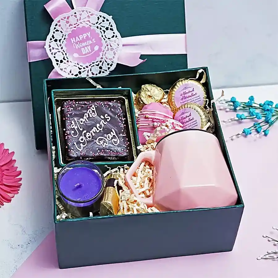 Sweetheart Delight Gift Hamper featuring chocolate brownie, scented candle, chocolates, strawberry crisp logs, heart-shaped hot chocolate pinata, almond rock, almond chocolate florentines, and an elegant cup.