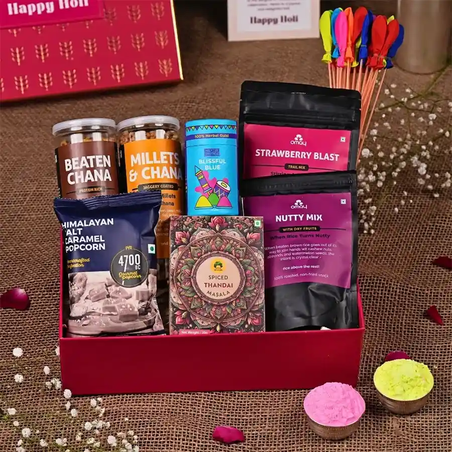 Luxurious Holi Celebrations Gift Box filled with tasty treats, colorful gulaal, water balloons, and a greeting card, elegantly packaged.