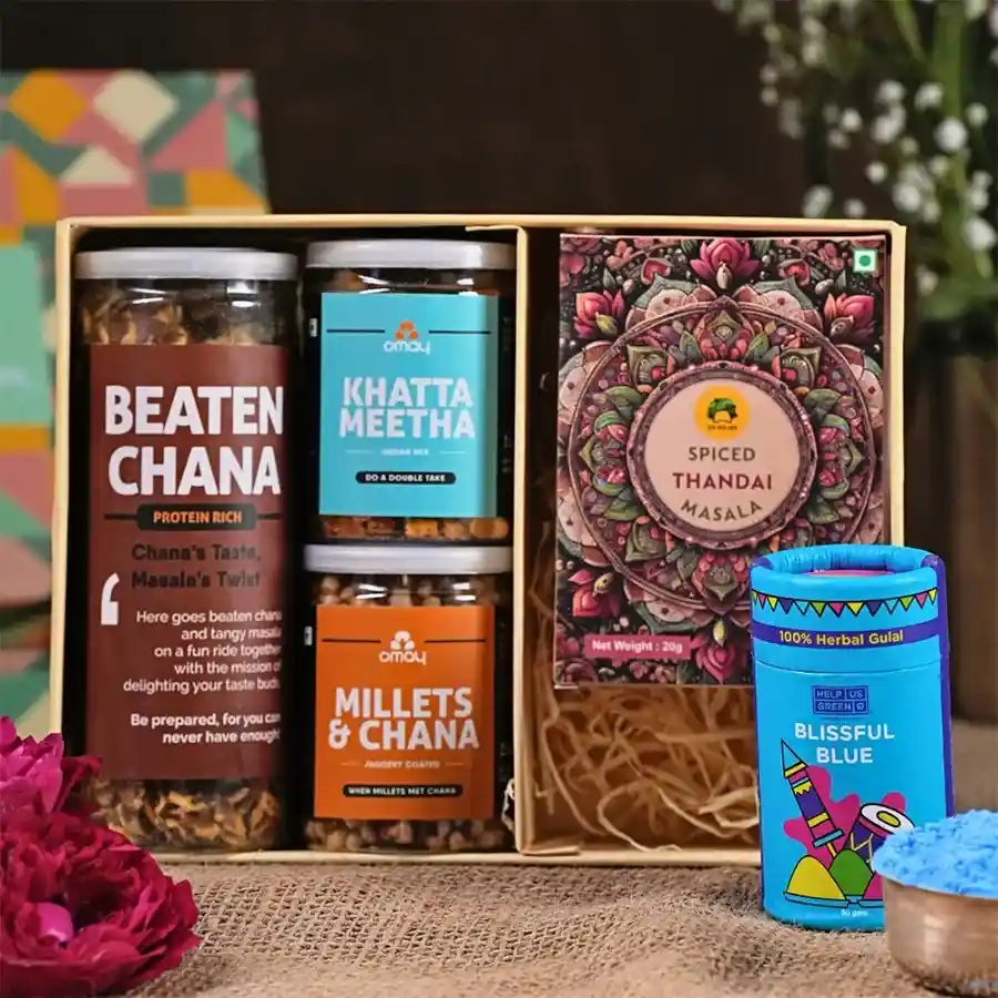 Fabulous Holi Treats Gift Box featuring protein-packed Beaten Chana, savory Millets & Chana Mix, tangy Khatta Meetha Mix, Gulab's Instant Thandai, vibrant Herbal Gulaal, and a Holi Greeting Card, all in a premium package.