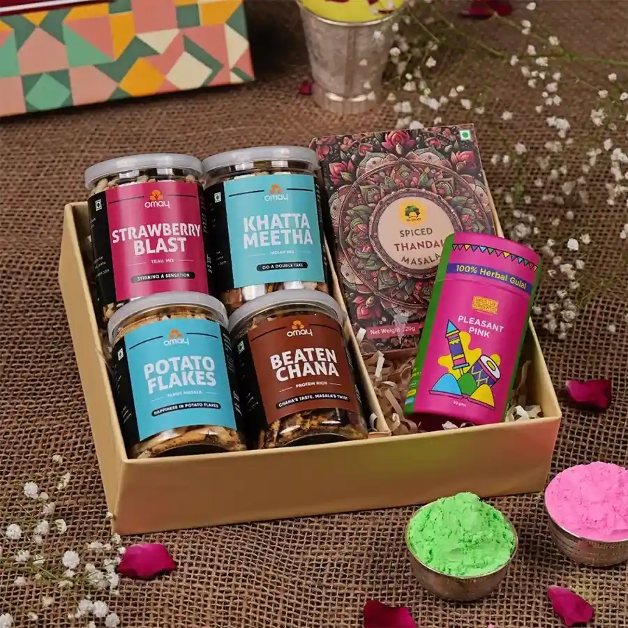 Elegant Holi Celebrations Gift Box featuring treats, herbal gulaal, instant thandai, and a greeting card, beautifully packaged.