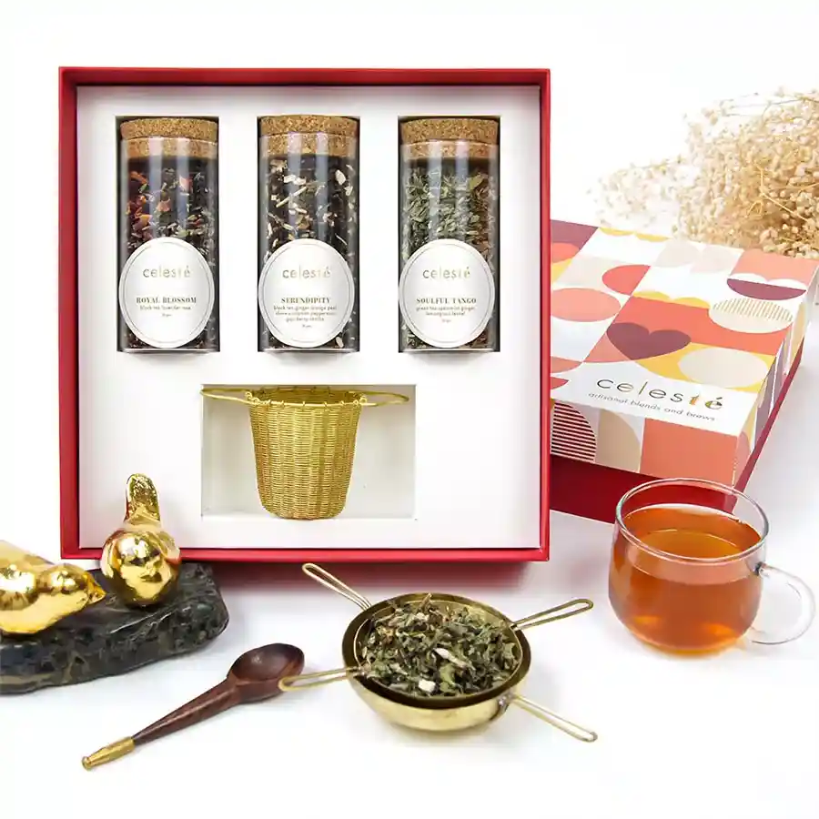 Luxury Assorted Tea Gift Set featuring Royal Blossom Black Tea, Serendipity Black Tea, Soulful Tango Green Tea, and a handwoven brass basket strainer in an elegant presentation.