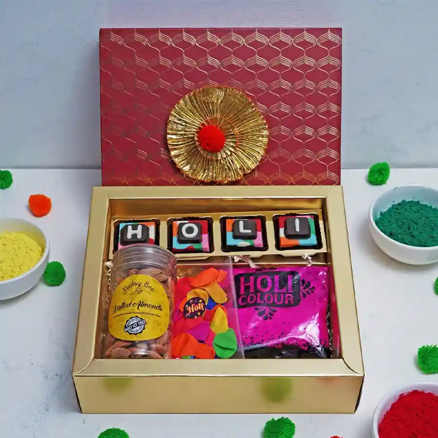 Blissful Holi Celebration Hamper featuring assorted chocolates, salted almonds, Holi colors, and balloons