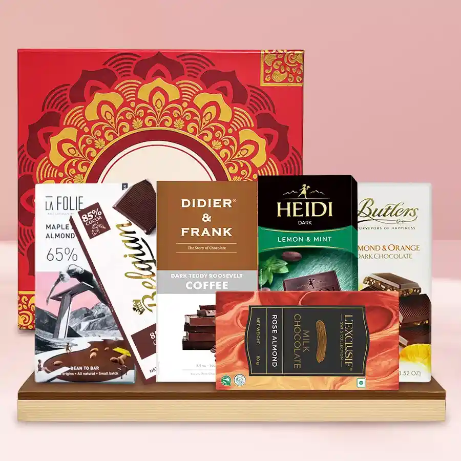 Luxury Chocolate Treats Collection in a reusable gift box featuring a variety of premium dark chocolates including almond and orange, coffee-infused, 85% Belgian dark, mint and lemon, rose almond, and almond 65% delights.