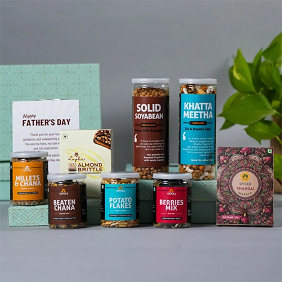 Father's Day gift hamper featuring a variety of snacks and a card, including Solid Soyabean, Khatta Meetha, Berries Mix, Beaten Chana, Millets N Chana, Potato Flakes, Loyka Almond Brittle, and Gulabs Instant Thandai.