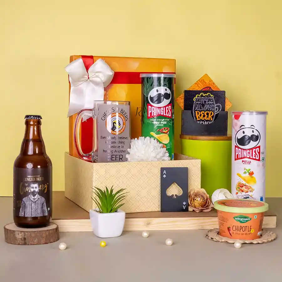 Exquisite Ginger Beer N Treats Hamper featuring Gunsberg Ginger Beer, a glass mug, bottle opener, coasters, Wingreen Chipotle Dip, and Pringles in Peri Peri and Salted Pizza flavors